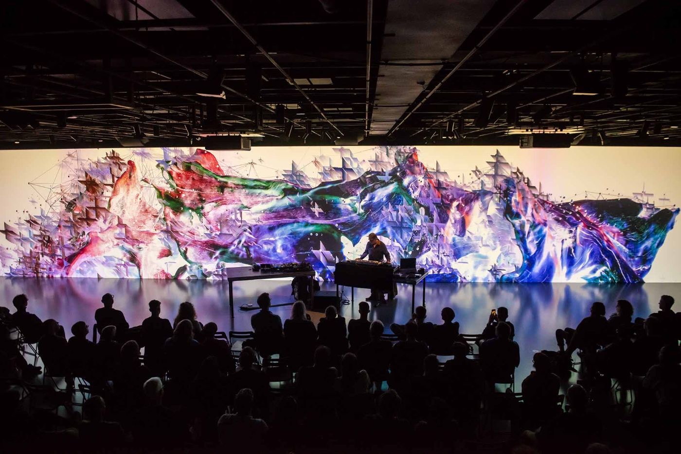 Live performance in front of a large-scale projection
