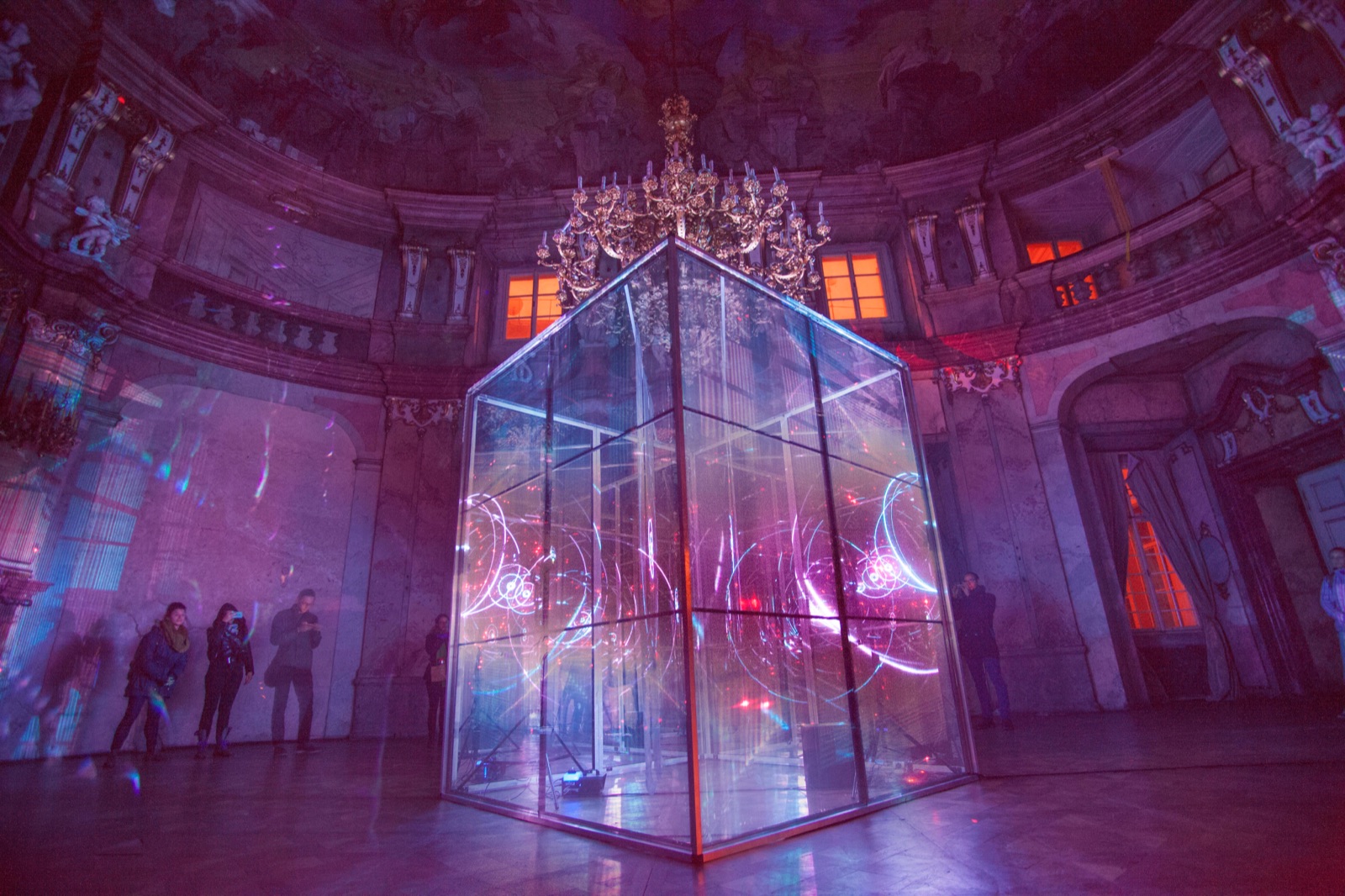 Glass cube light installation in a baroque hall
