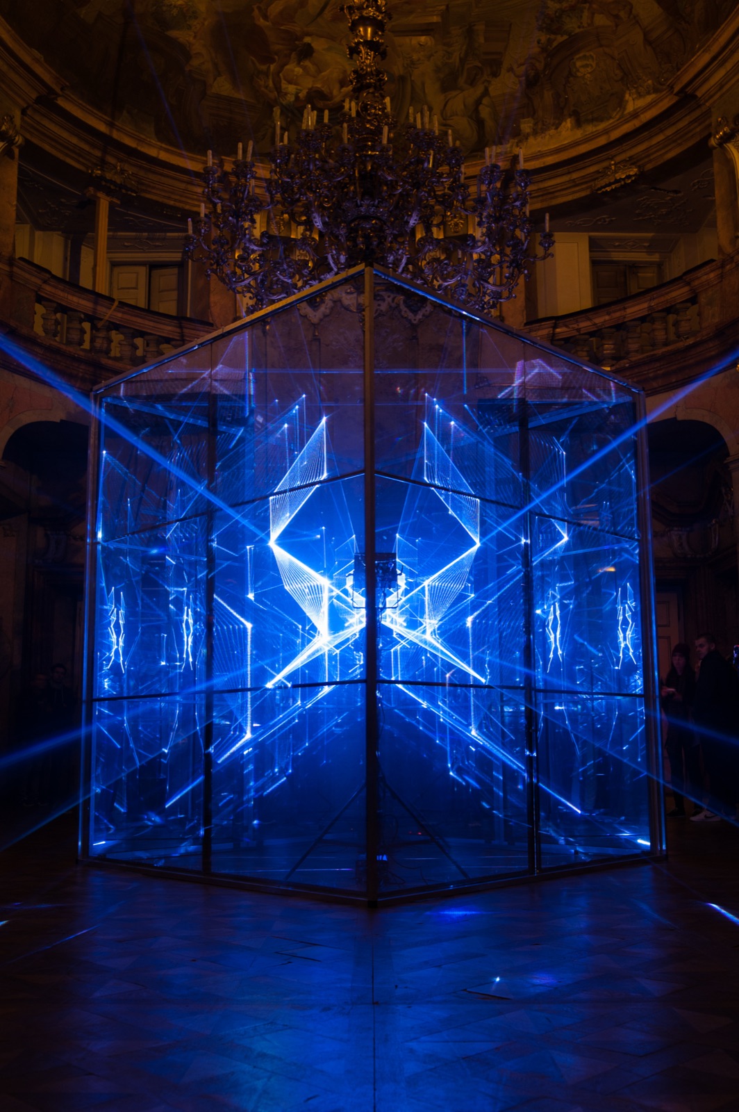 Laser beams inside a glass cube installation